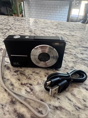 Compact Black Digital Point-and-Shoot Camera with USB Cable